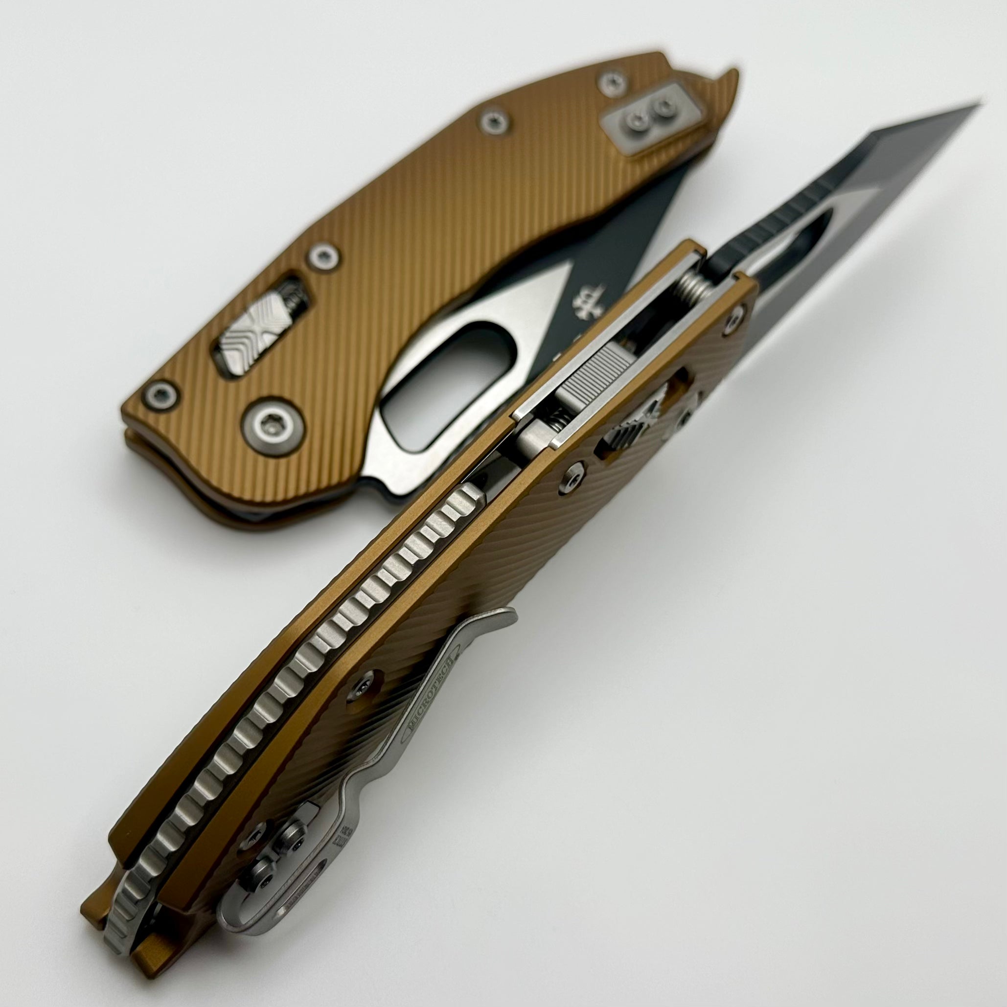 Microtech Knives Manual Stitch RAM LOK Fluted Tan Aluminum & Two Tone Black Partial Serrated M390MK 169RL-2FLTA