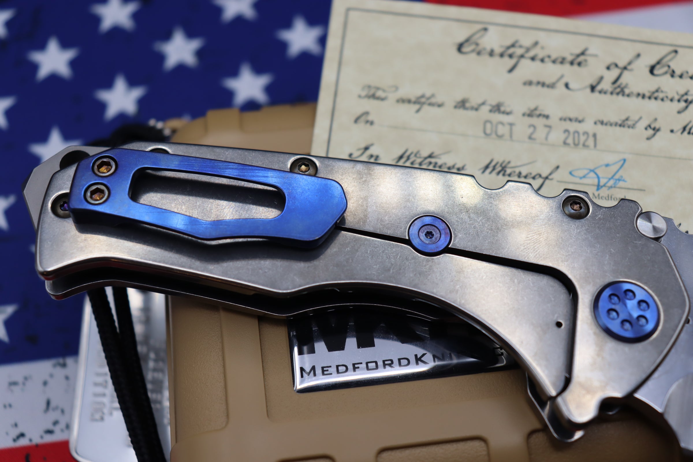 Medford Knife Praetorian T “We The People” Engraved & Blue Hardware with S35 Drop Point 106-047