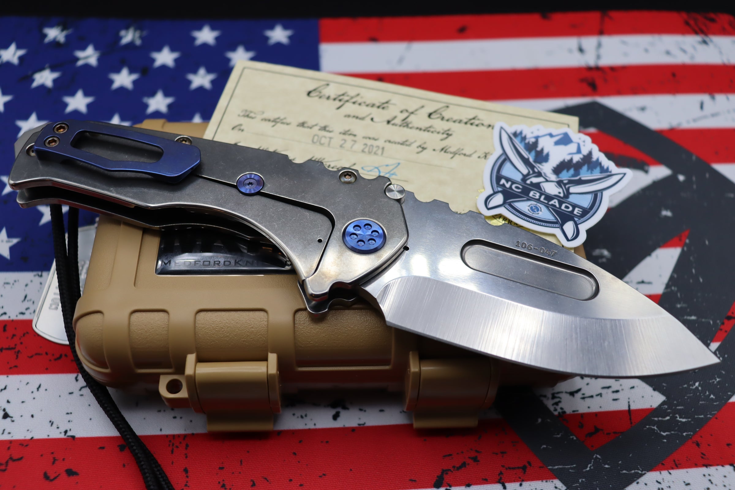 Medford Knife Praetorian T “We The People” Engraved & Blue Hardware with S35 Drop Point 106-047