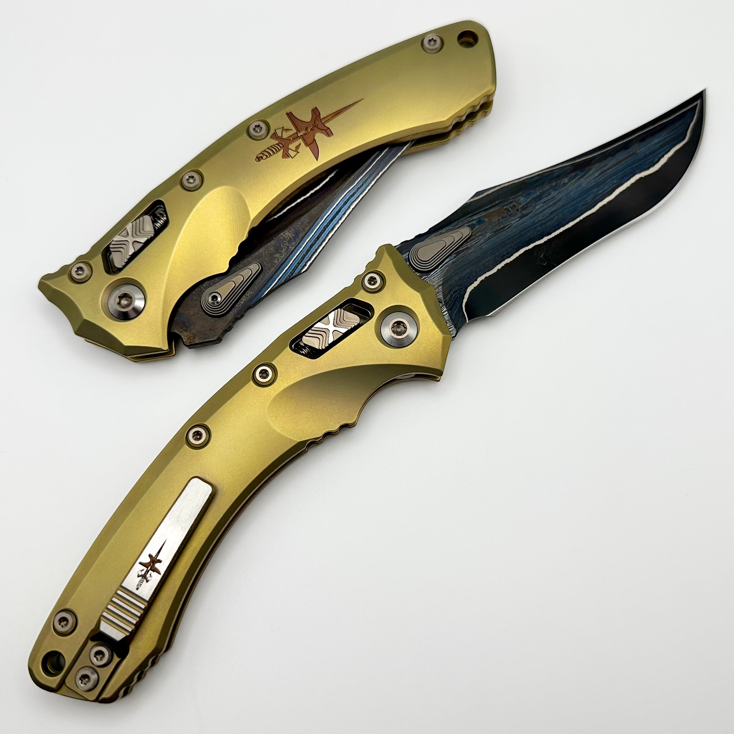 Marfione Custom Knives Amphibian RAM-LOK Terraform Pattern Broken Anvil Damascus & Sovereign Gold Stippled Titanium w/ Joint Logo Dagger Engraved & Two Tone Bronzed Hardware