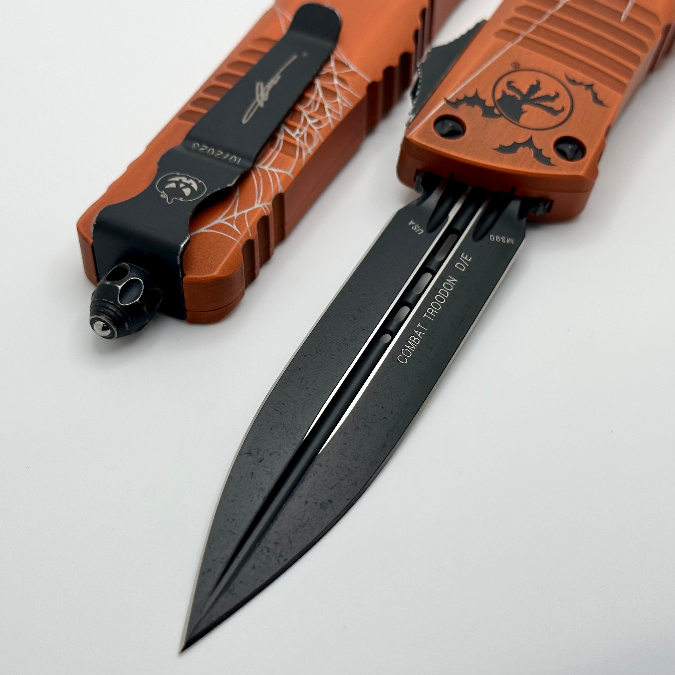 Microtech Combat Troodon D/E Halloween Web Orange Fluted Standard 23’ 142-1HWWS