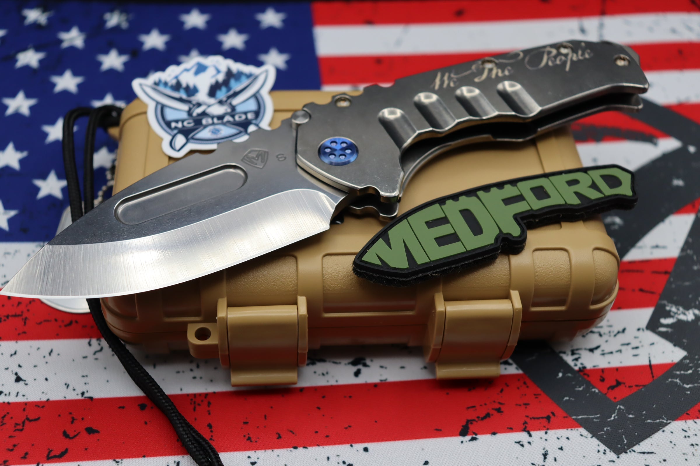 Medford Knife Praetorian T “We The People” Engraved & Blue Hardware with S35 Drop Point 106-047