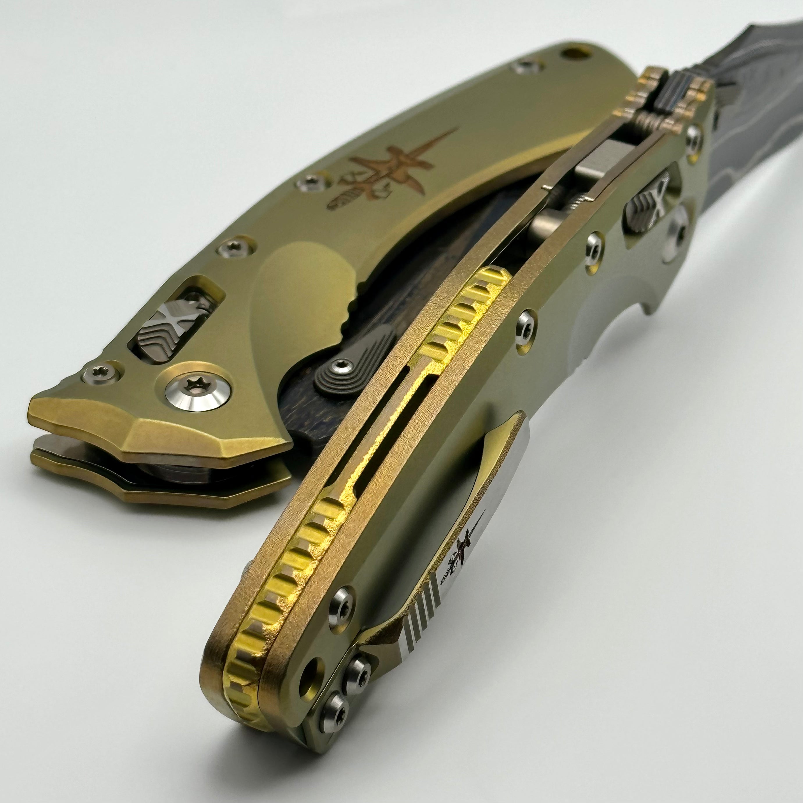 Marfione Custom Knives Amphibian RAM-LOK Metroid Sanmai w/ Nickel Shim Broken Anvil Damascus & Sovereign Gold Stippled Titanium w/ Joint Logo Dagger Engraved & Two Tone Bronzed Hardware