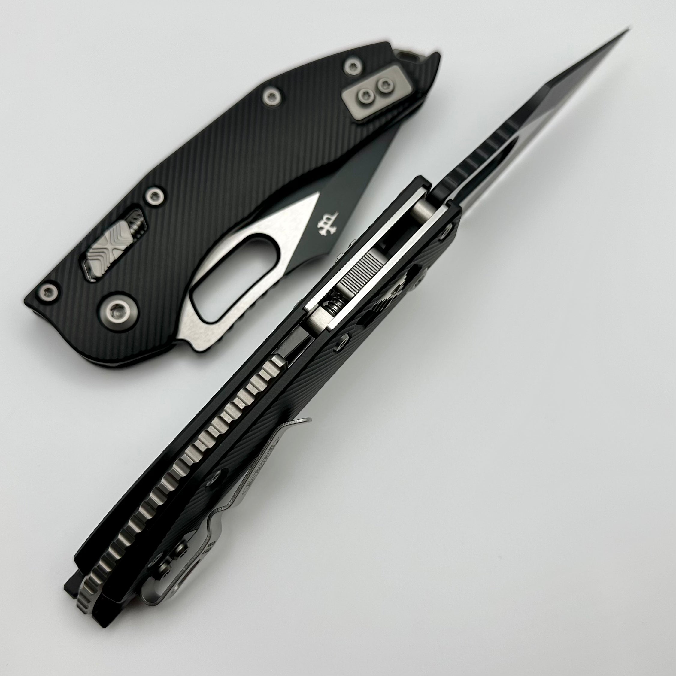 Microtech Knives Manual Stitch RAM LOK Fluted Black Aluminum & Two Tone Black Partial Serrated M390MK 169RL-2FL