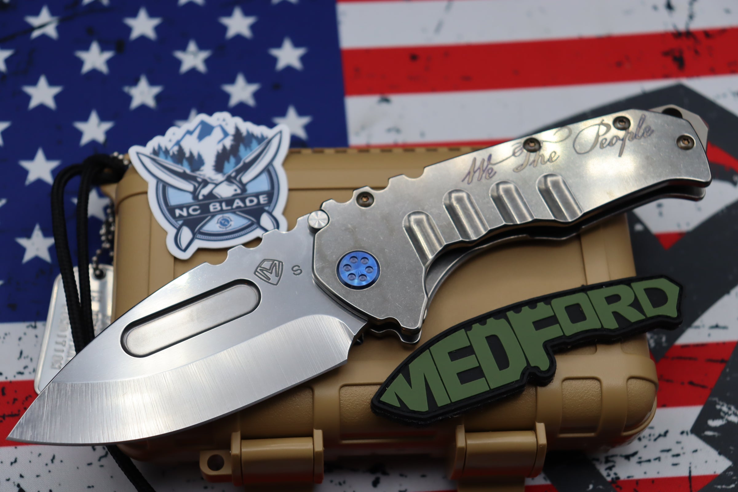 Medford Knife Praetorian T “We The People” Engraved & Blue Hardware with S35 Drop Point 106-047