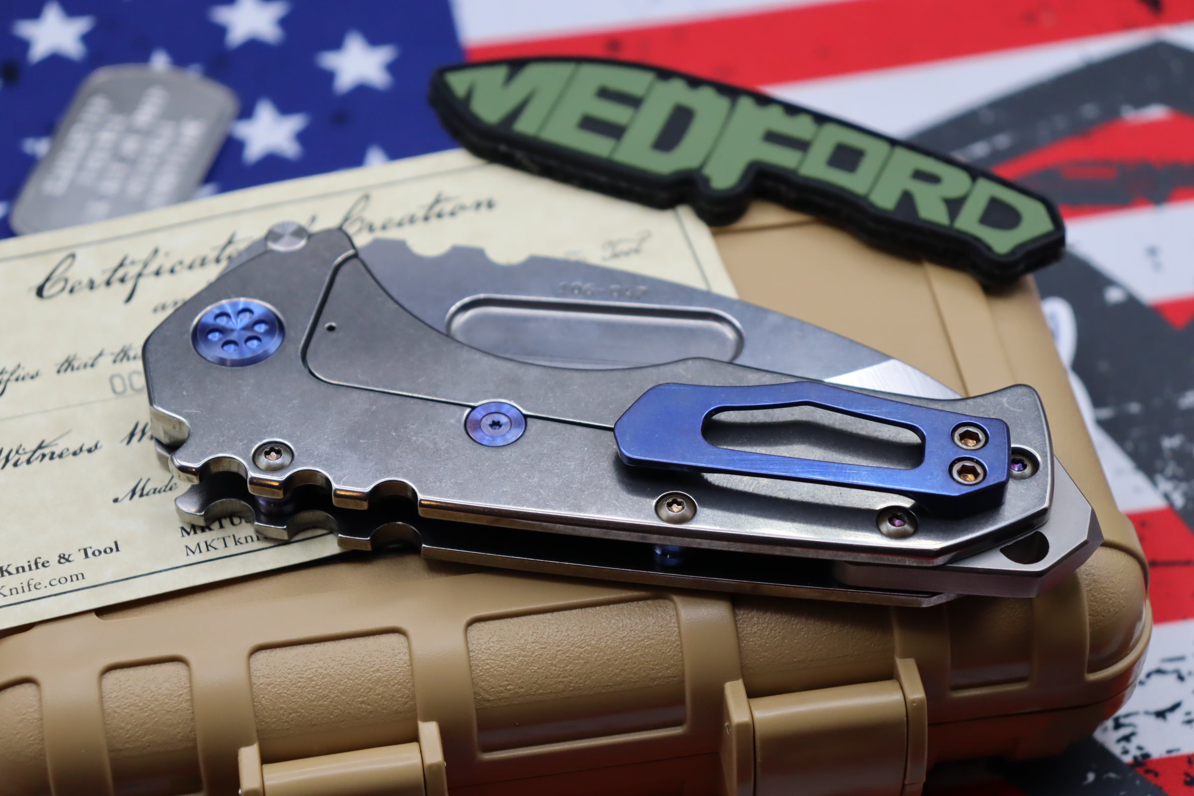 Medford Knife Praetorian T “We The People” Engraved & Blue Hardware with S35 Drop Point 106-047